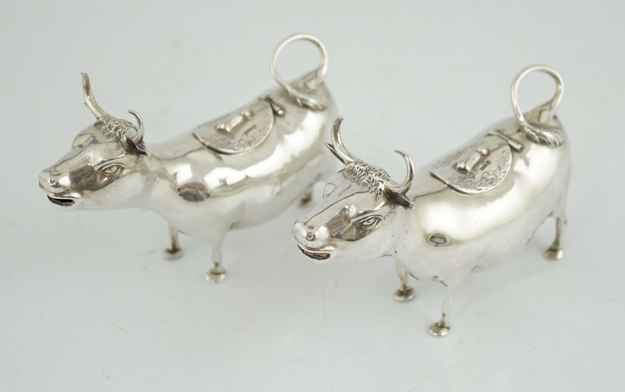 A pair of early 20th century continental silver cow creamers, by Berthold Muller